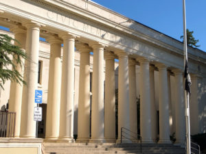 Civic Memorial Hall from sidewalk showing steps and classic architecture with many white pillars